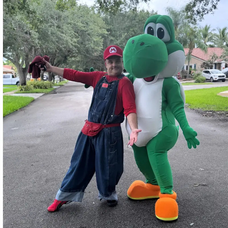 Mario and Yoshi character duo posing on a residential Miami street, video game party entertainment by Fantasy Entertainments.