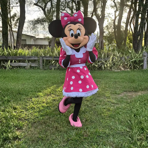 Minnie Mouse character rental in Miami: mascot in pink polka dot dress posing on a backyard lawn. Fantasy Entertainments.